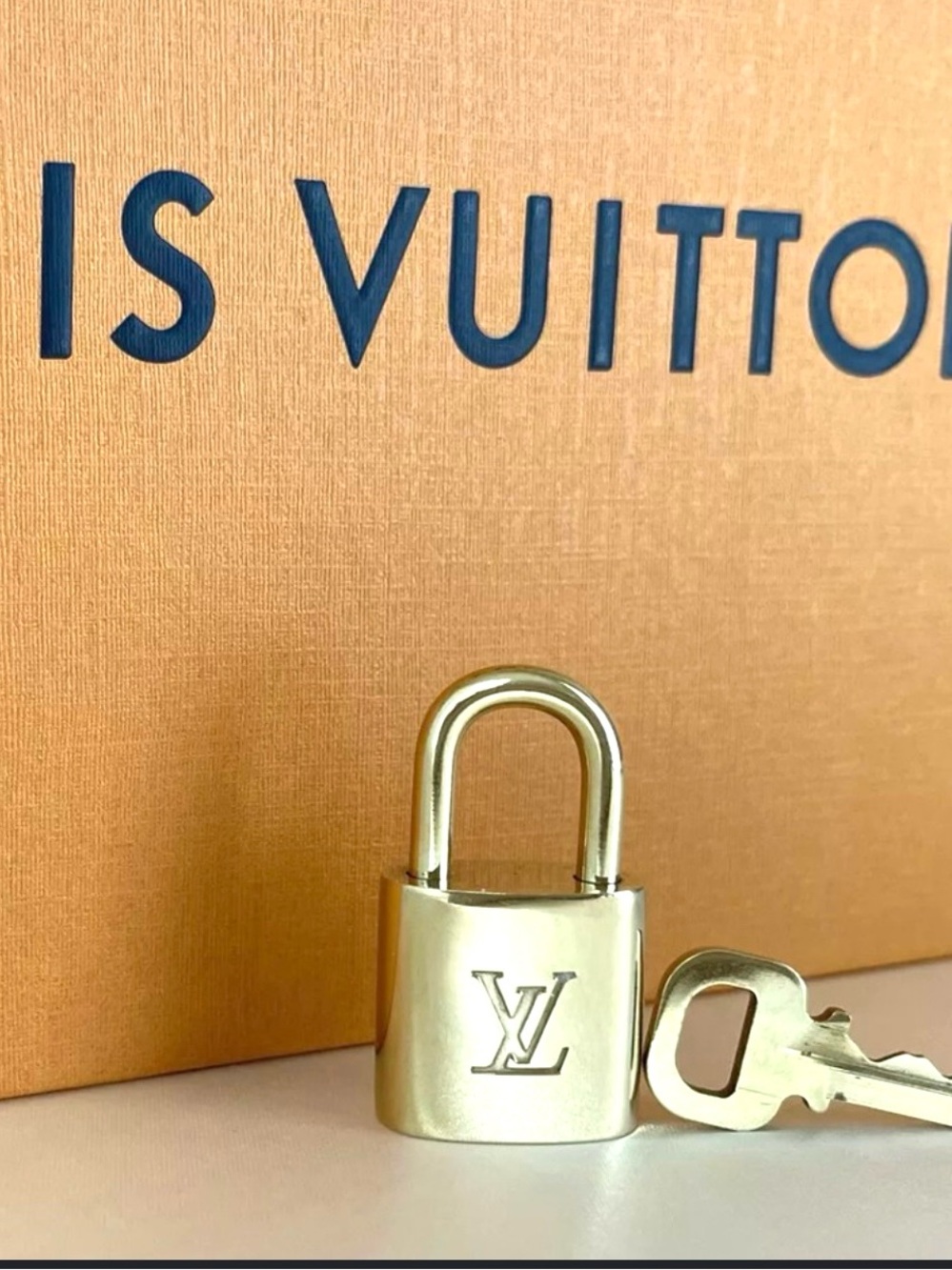 AUTHENTIC Louis Vuitton lock and key. Near mint.